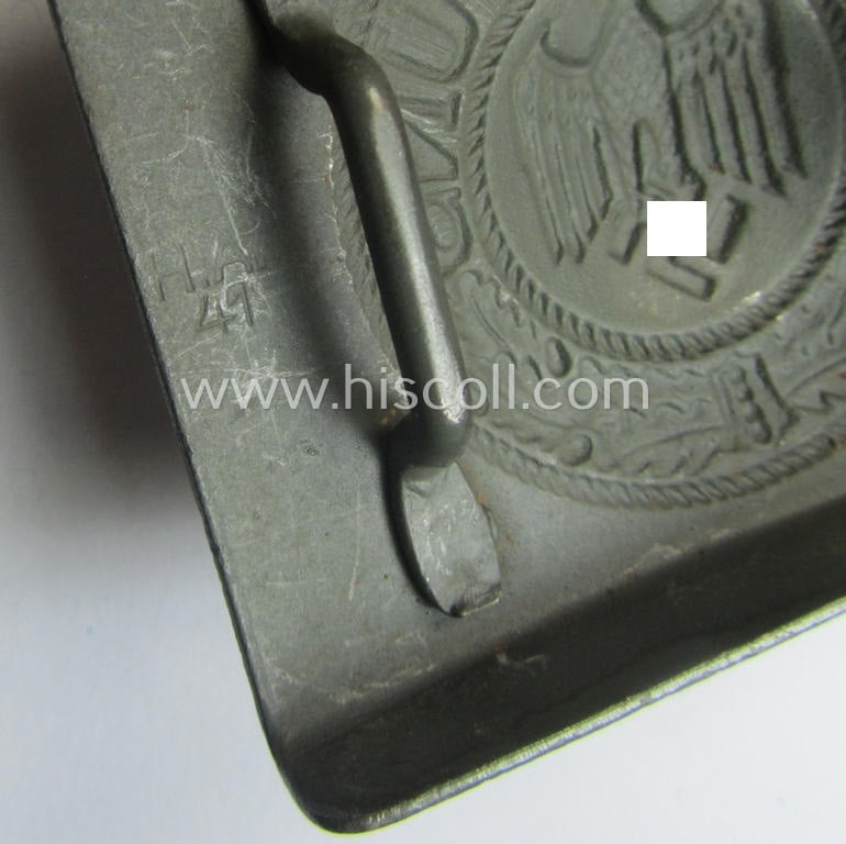 'Virtually mint', 'standard-issue'-pattern, WH (Heeres) field-grey-toned- and steel-based belt-buckle being a maker- (ie. 'H.A.41'-) marked example that comes mounted onto its: 'H. Arld - Nürnberg'-marked and/or: '1942'-dated tab