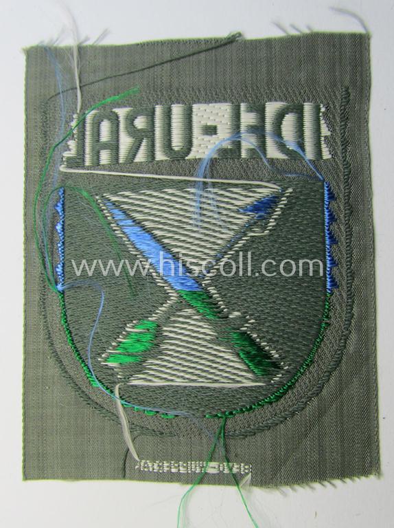 Attractive - multi-coloured- and 'BeVo'-woven - armshield (ie. 'Ärmelschild') entitled: 'Idel-Ural' as was intended for usage by a volunteer serving within the 'Volga-Tartar Legion') and that comes in a 'virtually mint- ie. unissued', condi...
