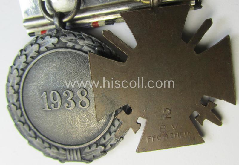 Unusually found, two-pieced (detachable!) medal-bar (ie. 'Doppelspange') respectively depicting a WWI-period: 'Frontkämpferkreuz 1914-18' (ie.: 'Kriegsteilnehmerkreuz mit Schw.') and a: 'Luftschutz-Ehrenzeichen 2. Stufe'