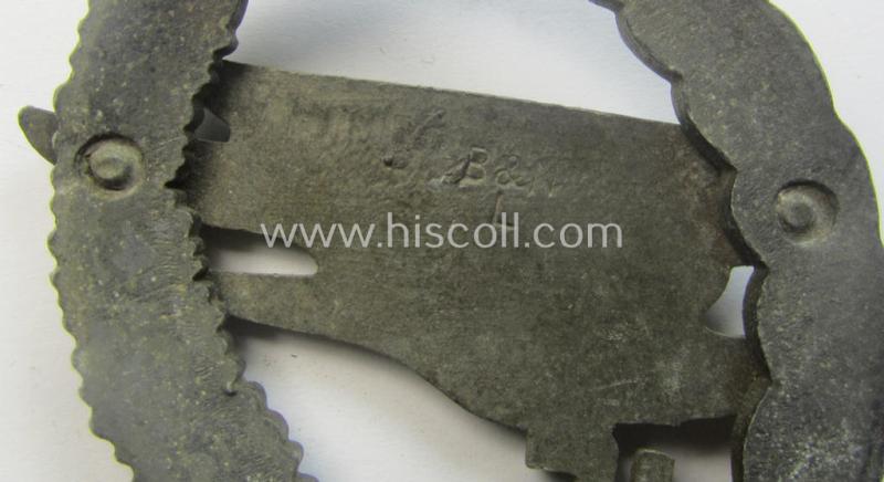 Regrettably incomplete, WH (Luftwaffe) 'Fallschirmschützen-Abzeichen' (or: paratroopers-jumpbadge) being a neatly maker- (ie. 'B&N - L'-) marked- and typical zinc- (ie. 'Feinzink'-) based example by the maker: 'Berg u. Nolte'