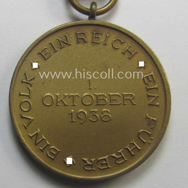 WH Czech-occupation- (ie. 'Anschluss'-) medal: '1. Oktober 1938' that comes mounted onto its period ribbon and that shows a firmly (and period!) attached 'Prager Burg-Spange'