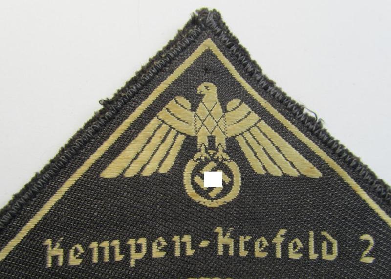 Attractive, German Red Cross (ie. 'Deutsches Rotes Kreuz' or 'DRK') greyish-coloured- and/or (typically) triangular-shaped arm-eagle entitled: 'Kempen-Krefeld 2' as was executed in the neat 'BeVo'-weave pattern