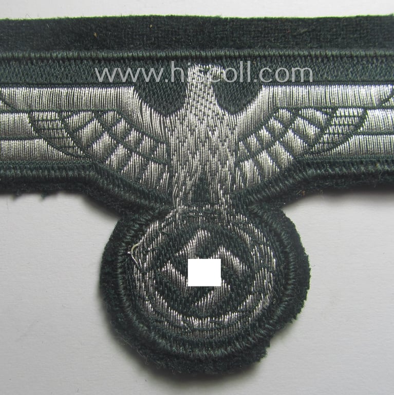 WH (Heeres) breast-eagle as executed in 'BeVo'-type, 'flat-wire'-weave-pattern and pre-mounted on darker-green-coloured wool as was intended for usage by soldiers (ie. NCOs) on their dress-tunics (ie. 'Waffenröcke')