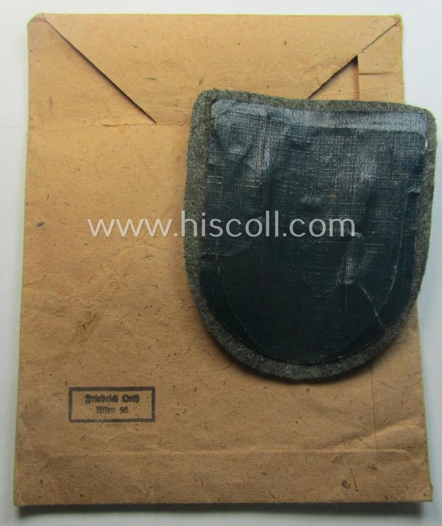 WH (Heeres ie. Waffen-SS) 'Krim'-campaign-shield (by the maker: 'Friedrich Orth') that comes stored in its period (and rarely seen!) 'Zellstoff'-based pouch and that comes in a probably issued- (albeit still 'virtually mint'-), condition