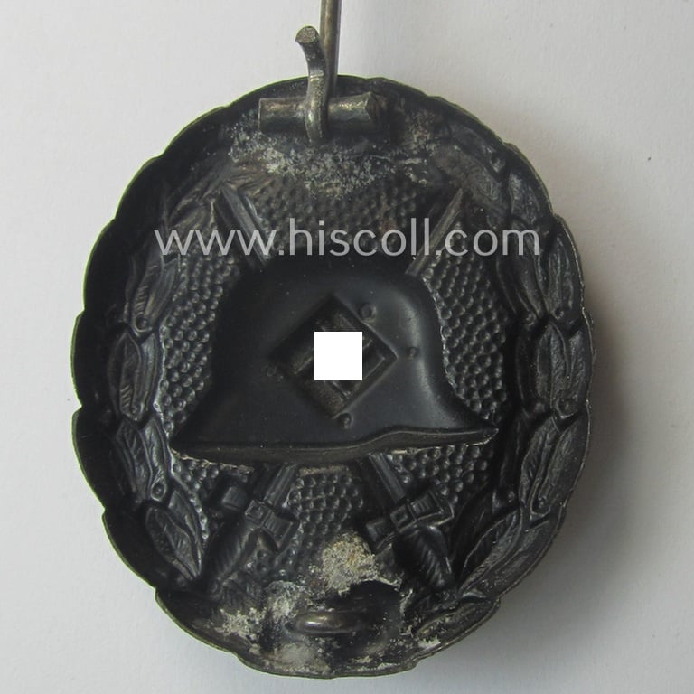 Attractive, early-pattern black-class wound-badge (ie.: 'Verwundeten Abzeichen in Schwarz') being a detailed so-called: 'Spanish Civil-War'-version that comes in a just moderately used- and/or worn, condition
