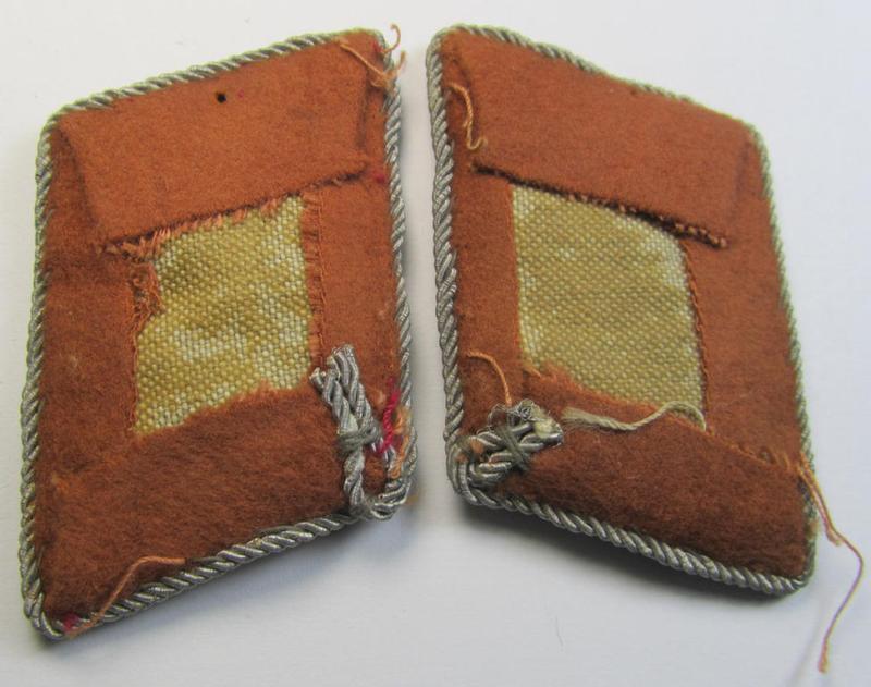 Moderately worn and fully matching, 4-pieced insignia-grouping comprising of a pair of WH (LW) officers'-type shoulderboards and dito collar-tabs as was intended for usage by a: 'Hauptmann u. Mitglied der Nachrichten-Truppen'