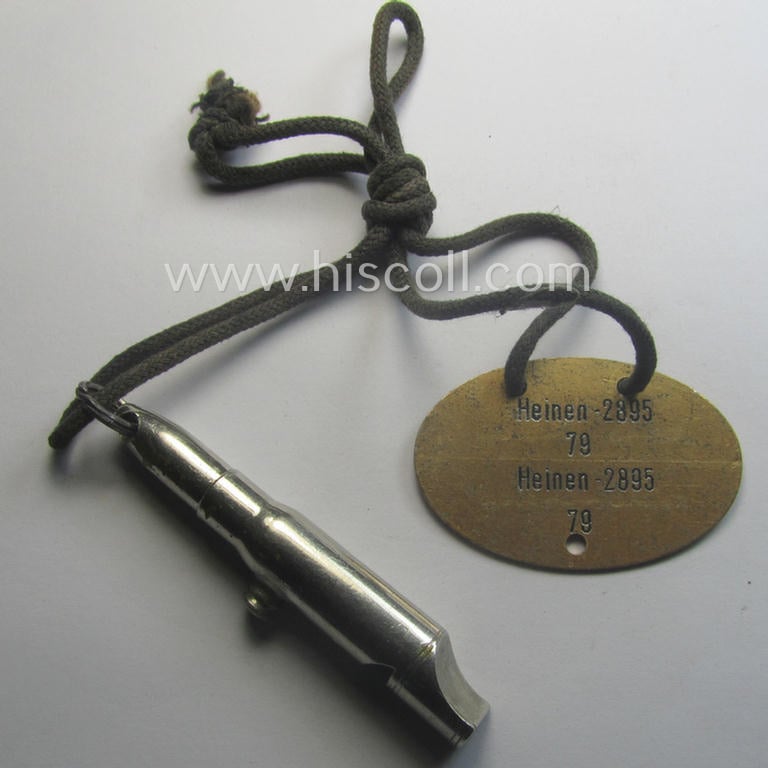 'Standard-issue'-pattern, WH (KM) typical aluminium-based- and/or bright golden-toned ID-disc (ie. 'Erkennungsmarke'): 'K.M.W. Ress. I - Wihelmshaven -  Heinen - 2895 - 79' and accompanying 'Bootsmanns-Flöte'