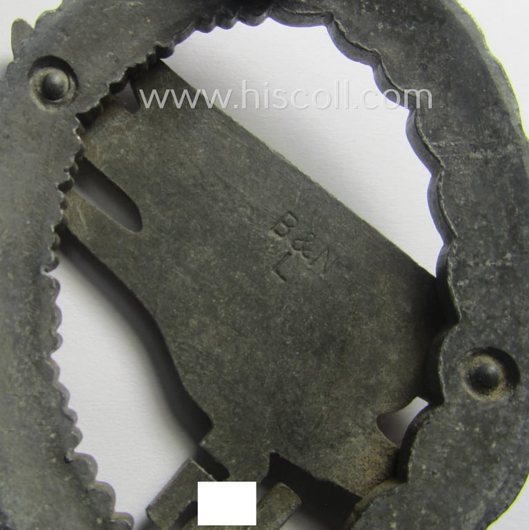 WH (Luftwaffe) 'Fallschirmschützen-Abzeichen' (or: paratroopers-jumpbadge) being a maker- (ie. 'B&N - L'-) marked- and typical zinc- (ie. 'Feinzink'-) based example by: 'Berg u. Nolte'