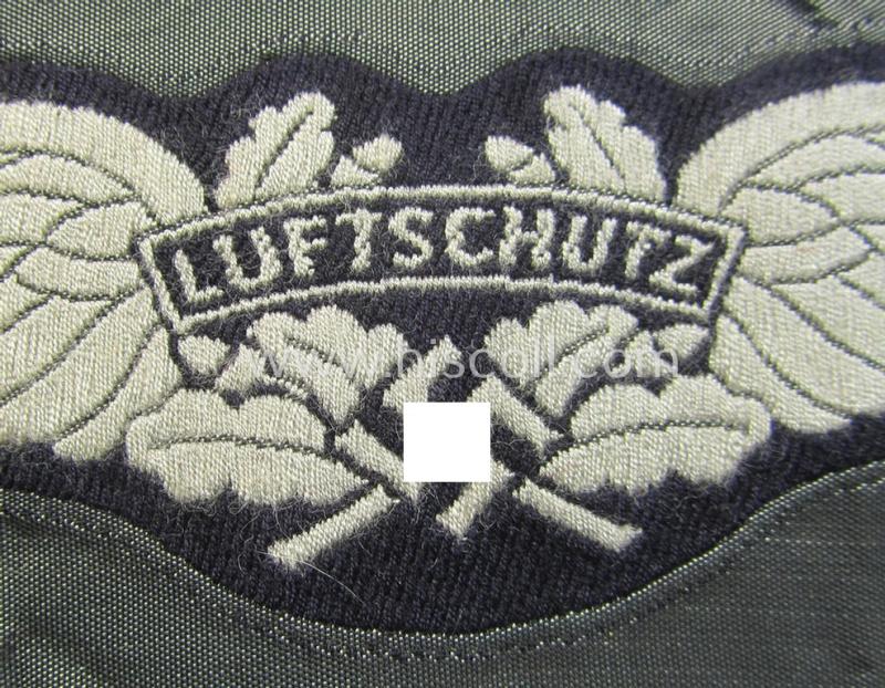 Attractive - and scarcely encountered! - EM- (ie. NCO-) pattern, so-called: 'Luftschutz' (ie. RLB-) breast-badge (ie. 'Brustabzeichen') as executed in so-called: 'BeVo'-weave-pattern and that comes in a 'virtually mint- ie. unissued' conditio...