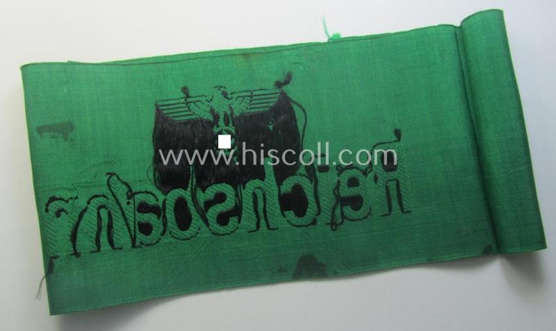DRB- (ie. 'Deutsche Reichsbahn'-) related armband entitled: 'Reichsbahn' being of the 'entirely-woven'-type onto (typical) silk-like cloth in a technique similar to the 'BeVo'-weave pattern