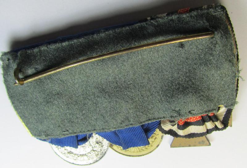 Attractive, 3-pieced medal-bar (ie. 'Ordenspange') showing resp. a WWI-period: 'FKK 1914-18 ohne Schw.' and two WWII-period: WH (Heeres or KM) so-called: 'Dienstauszeichnungen für 4 u. 12 Jahre Treue Dienste'