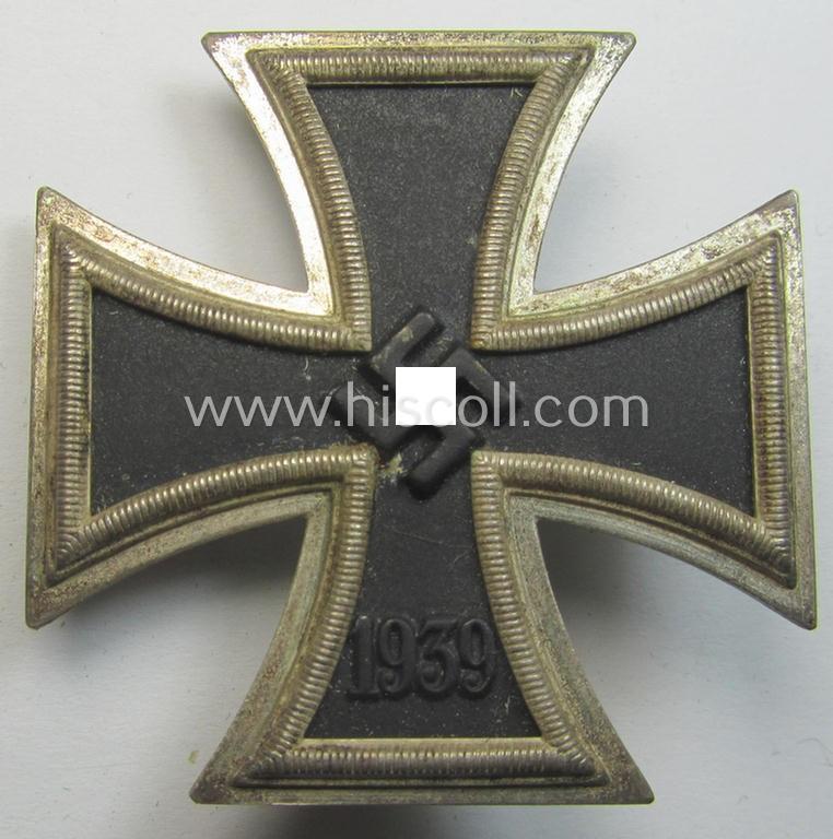 'Eisernes Kreuz 1. Klasse' (ie. Iron Cross 1st class) being an (I deem) mid-war-period produced, neatly maker- (ie. '20'-marked thus by the maker: 'C.F. Zimmermann'-produced) example