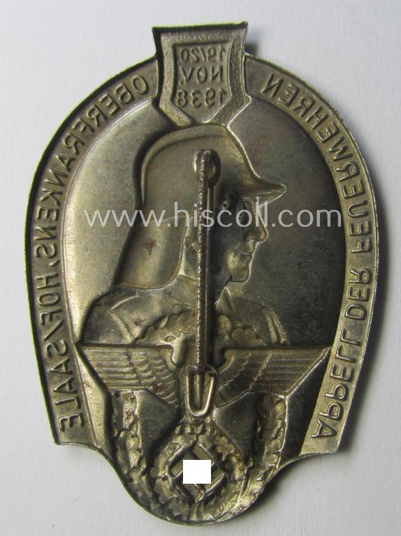 Commemorative, hollow-back- and/or silverish-grey-toned, so-called: 'Feuerwehr'-related day-badge (ie. 'tinnie') as executed in zinc-based-metal that is showing the text: 'Appell der Feuerwehren Oberfrankens - Hof/Saale - 19./20. November 1938'