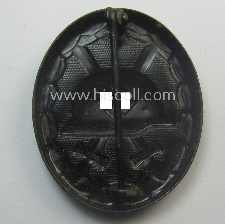 'Verwundeten-Abzeichen in Schwarz' being a maker- (ie. '4'-) marked example by the: 'Steinhauer & Lück'-company that came stored in its (scarcely seen!) period pouch