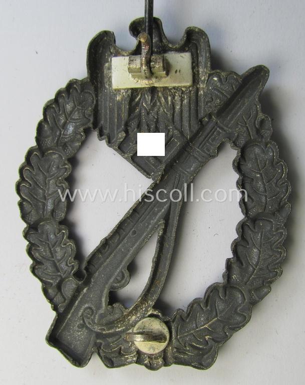 Attractive, 'hollow-back'-pattern 'Infanterie Sturmabzeichen in Silber' (or: silver infantry-assault badge ie. IAB) being a non-maker-marked example as executed in zinc-based metal (ie. 'Feinzink') as was produced by the: 'Wilh. Deumer'-compa...