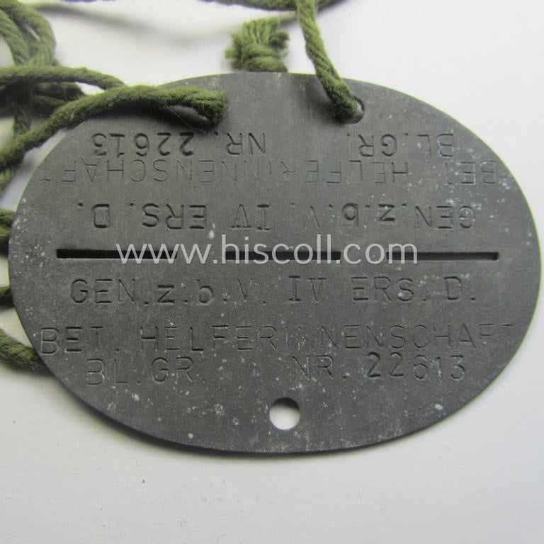 Interesting, zinc- (ie. 'Feinzink'-) based, female-staff-related ID-disc (ie. 'Erkennungsmarke') bearing the stamped unit-designation: 'Gen. z.b.V. IV Ers.D. - Betr.Helferinnenschaft'