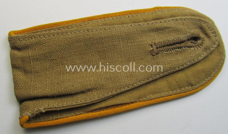 Single, WH (Luftwaffe) tropical-issued, EM-type-shoulderstrap as executed in beige-coloured linnen (as was specifically intended for usage on the tropical-shirts ie. tunics) as was intended for a: 'Soldat der Flieger- o. Fallschirmjäger-Truppen'