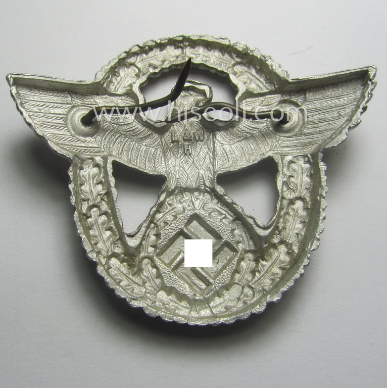 'Standard-issue'-pattern - and typical aluminium-based - 'Polizei'- (ie. police) visor-cap eagle being a bright-silver-coloured (and maker- ie. 'L&W H'-marked) example as was intended for usage on the various 'Polizei' (ie. police) visor-caps