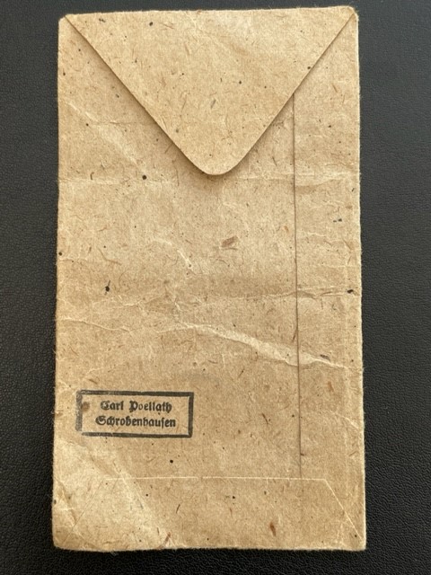 WWII GERMAN WEST WALL MEDAL WITH PAPER ISSUE PACKET.