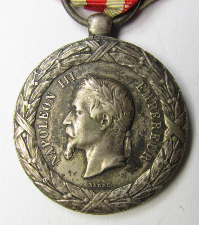 Attractive French, 'Second Empire-period', so-called: 'Expedition to Italy'-campaign-medal (ie. 'Médaille Commémorative de l'Expédition du Italie') that comes mounted on its period-ribbon as issued