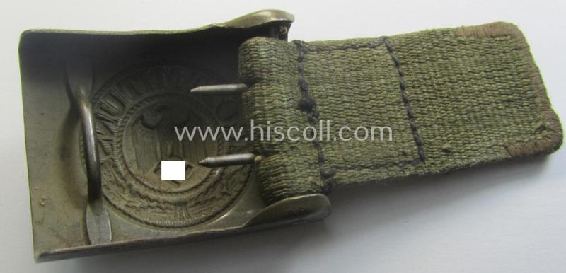WH (Heeres) 'tropical-issued' belt-buckle being a non-maker-marked (and/or period re-sprayed!) bluish-coloured example that comes mounted onto its original, greenish-coloured- (and/or: 'webbing'-based-) tab