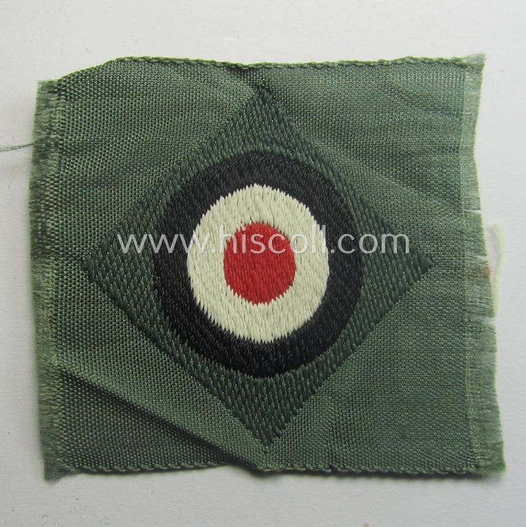 Early- (ie. mid-) war-period, WH (Heeres) cap-eagle & cocarde-set (ie. 'Schiffchenmützen-Adler u. Kokarde-Satz für Mannschaften u. Uffz.') being a 'virtually mint' set as executed in bluish-grey-coloured linnen on a field-grey-coloured background