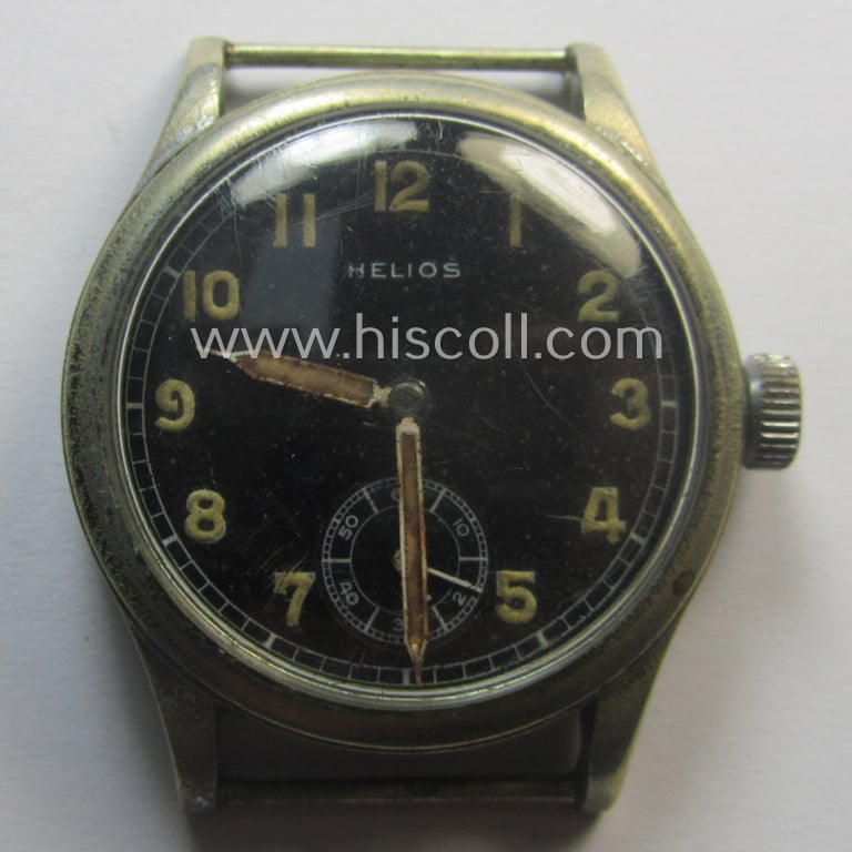 Attractive - and scarcely encountered! - WH (Heeres, LW etc.) WWII-period wrist-watch (or: 'Dienstuhr') of the make: 'Helios' having an engraved number: 'D10200H' on its back (and that comes in a still running condition)