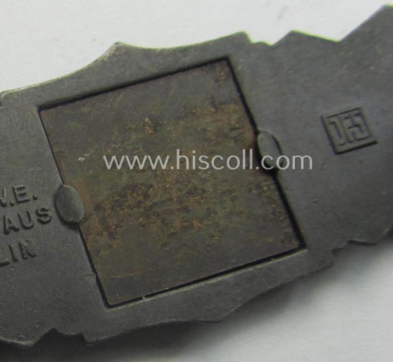 'Nahkampfspange in Bronze' (or: bronze-class close-combat clasp ie. CCC) being a neatly maker-marked- and/or minimally converse-shaped specimen as was produced by the: 'JFS'- (ie. 'Joseph Feix u. Söhne'-) company