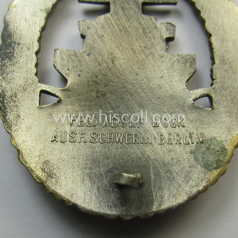 Moderately used, WH (Kriegsmarine) 'Flottenkriegsabzeichen' (or: high-sea fleet badge) being a typical 'Buntmetall'-based specimen that is neatly maker- (ie. 'Fec. Adolf Bock') marked on its back