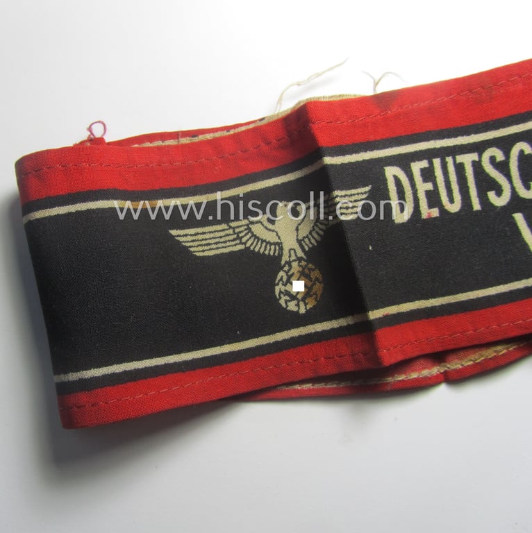 Moderately worn example of a (typically printed- and/or later-war-period) bright-red- and/or black-coloured so-called: 'Deutscher Volkssturm'-armband (ie. 'Armbinde') that comes in an overall nice condition