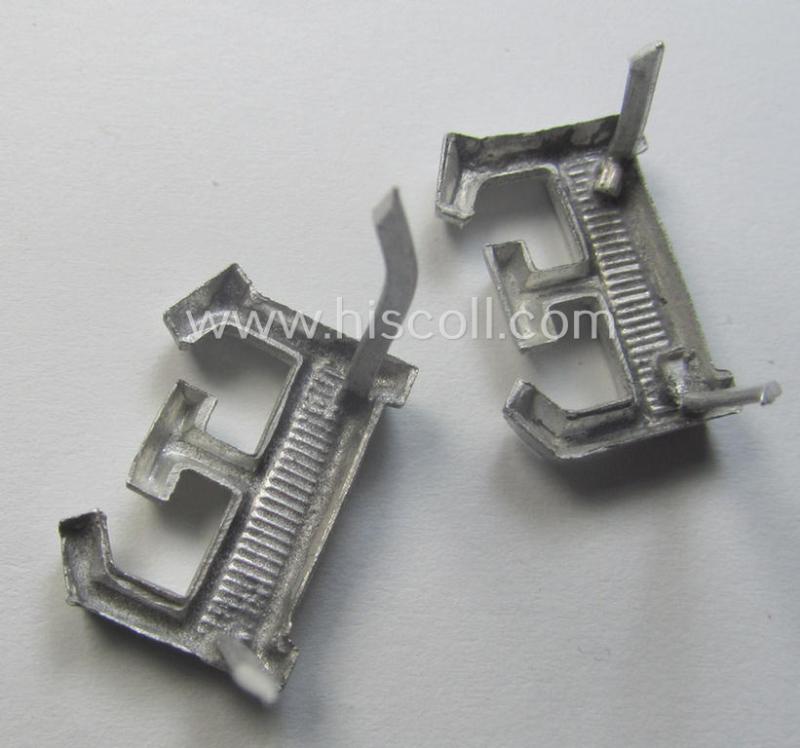 Pair of NCO-type- (thus silver-coloured), Waffen-SS- (ie. SS-VT-) related shoulderstrap-cyphers (ie. 'Schulterstückauflagen o. Ziffern') depicting a capital 'E'-character for usage by an NCO serving within the: 'Ergänzungsstellen der Waffen-SS'