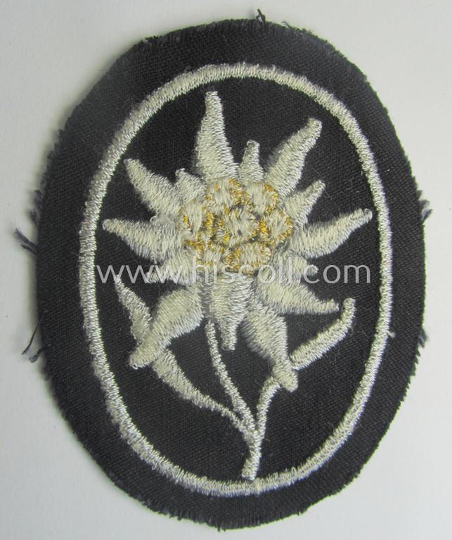 Waffen-SS-pattern, black-coloured sleeve-insignia (ie. 'Ärmelabzeichen') depicting an: 'Edelweiss'-flower as used by the various 'Gebirgsjäger'- (ie. mountain-troops-) related divisional-staff