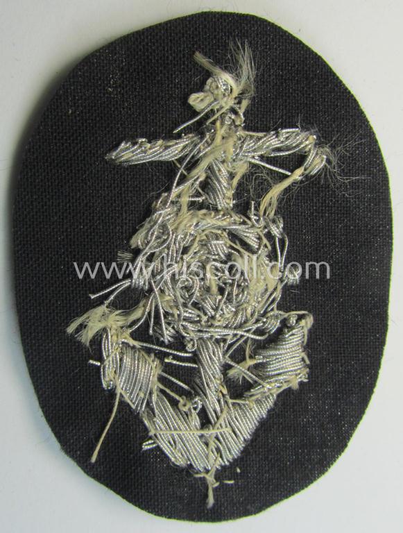 Superb, WH (Heeres) trade- and/or special-career insignia, being a detailed- and/or neatly hand-embroidered example as executed on darker-green-coloured wool, as was intended for a: 'Steuermann' (ie. enigineer-boat-pilot or helmsman)