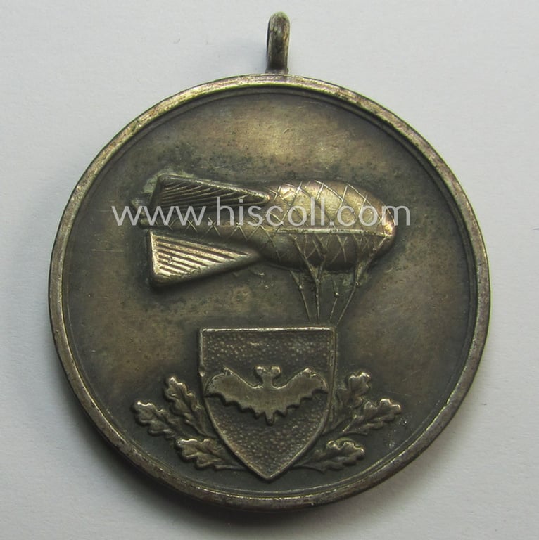 Never before seen, TR-period commemorative-medal (ie. 'Erinnerungs- o. tragbare Medaille') showing a WH (LW) eagle-device and text/date: '1942 Luftsperrabteilung 2/101' and showing on its back an illustration of a: 'Sperrballon'