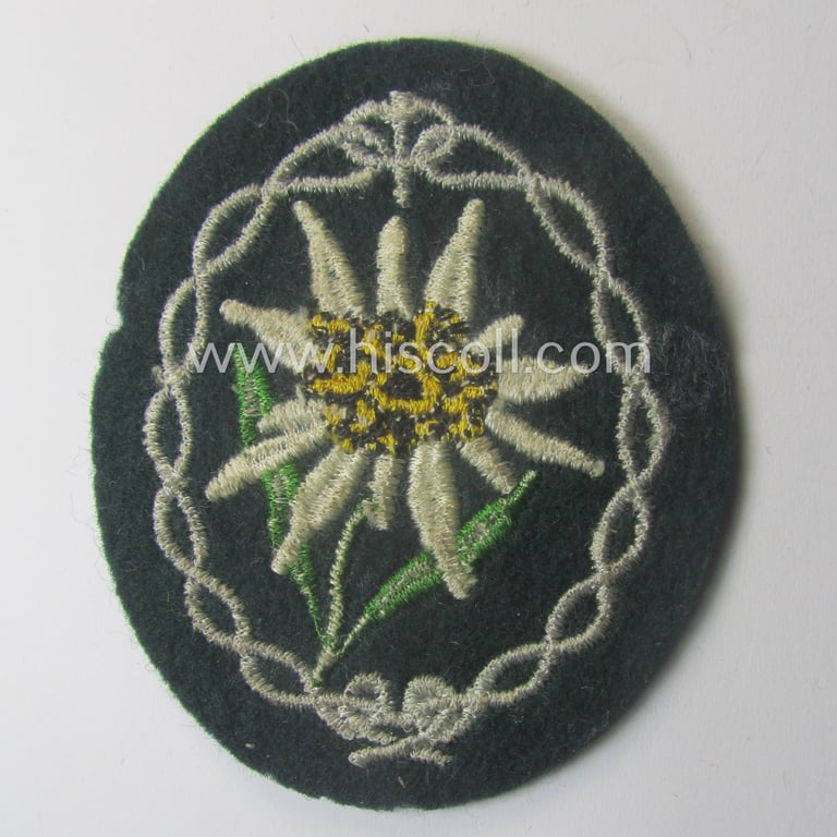 WH (Heeres) EM- (ie. NCO-) type: 'Edelweiss'-armpatch (being a machine-embroidered specimen)