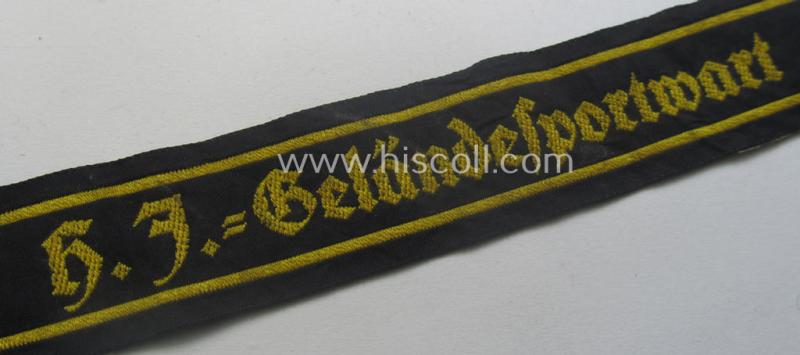 Truly worn- ie. tunic-removed, HJ (Hitlerjugend) cuff-title ie. 'tunic-stripe' (ie. 'Ärmelbänd') as was intended for a: 'HJ-Geländesportwart' (or: HJ-terrain-sports'-instructor)