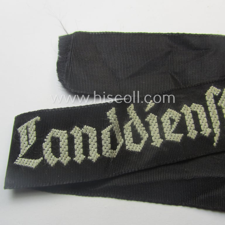Moderately worn (example) of the - actually very scarcely encountered! - HJ ('Hitlerjugend') armband (ie. cuff-title) as woven in the neat 'BeVo'-like-pattern, entitled: 'Landdienst der HJ'
