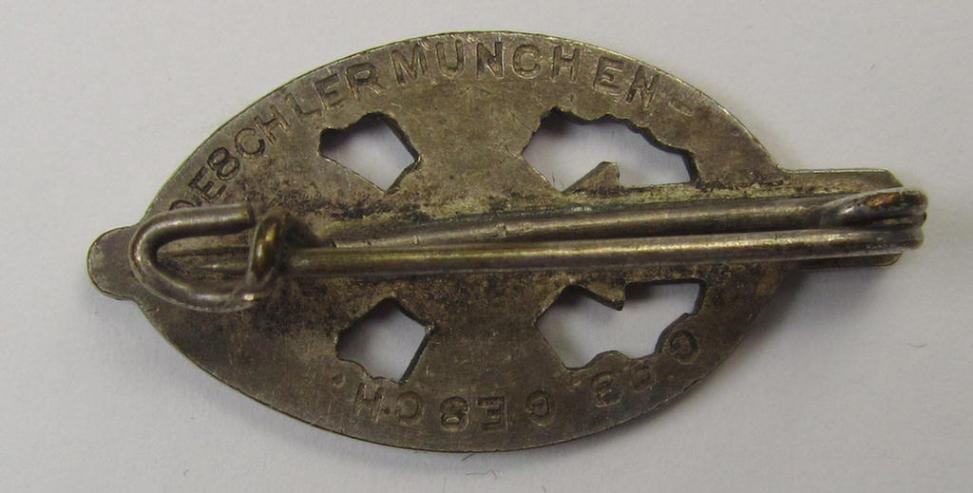 Membership-lapel-pin as was intended to signify membership within the: 'Nationalsozialistischer Kriegsopferversorsung' (ie. 'N.S.K.O.V.') being a maker- (ie. 'Deschler'-) marked example that also shows a: 'Ges.Gesch.'-patent-pending-designati...
