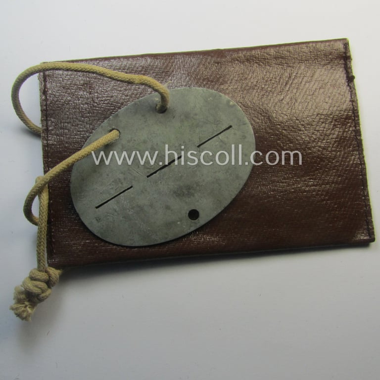 Zinc-based, WH (Heeres-) transport (ie. 'Nachshub'-) related ID-disc bearing the clearly stamped unit-designation: 'Stammkomp/Kf.Ers.Abt. 17' and that comes stored in its period-pouch as issued and/or worn