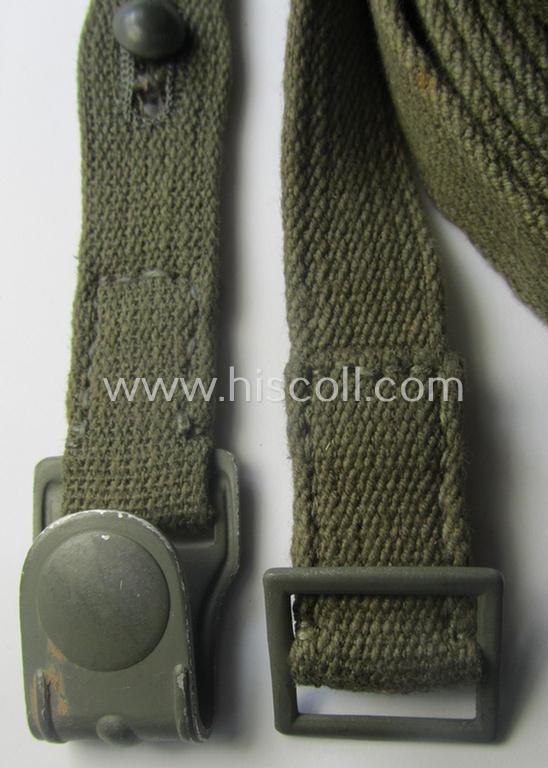 Complete, 2-pieced 'standard-issue'-pattern- (ie. typical WH-issue) carrying-strap (ie. 'Tragelasche') as was intended for the various gasmask-containers (being a maker-marked example that comes in a just minimally used, condition)