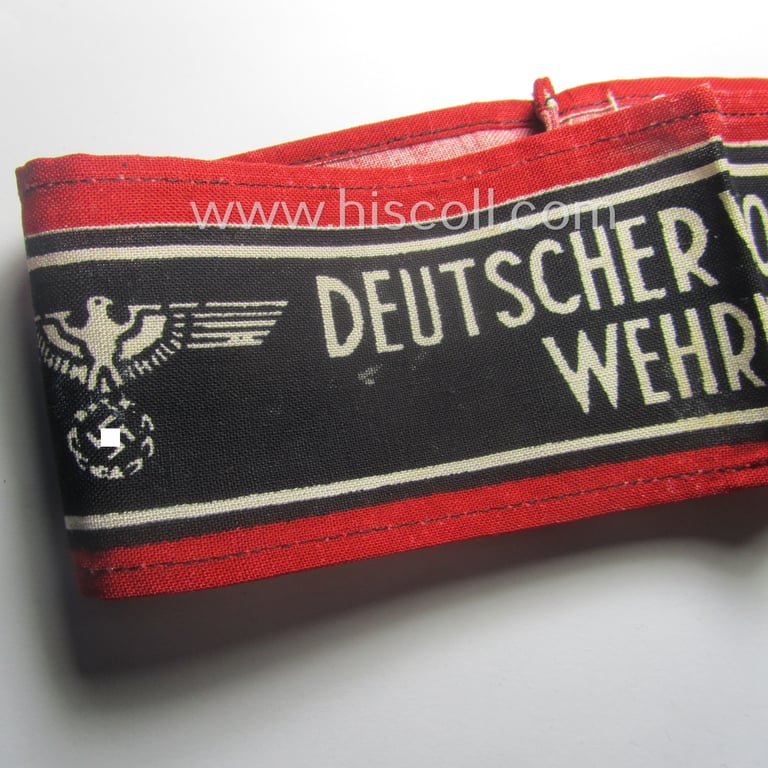 Typically printed- and/or later-war-period, bright-red- and/or black-coloured so-called: 'Deutscher Volkssturm'-armband (ie. 'Armbinde') that comes in an overall very nice- (I deem hardly used- nor worn- ie. 'virtually mint'-), condition