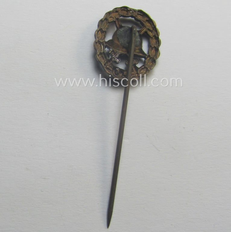 WWI-period - and 17 mm. sized! - miniature lapel-pin (ie. 'Halbminiatur') depicting a: 'Verwundeten-Abzeichen in Schwarz' (or: black-class wound-badge) being a non-maker-marked example of the 'durchbrochner'-pattern