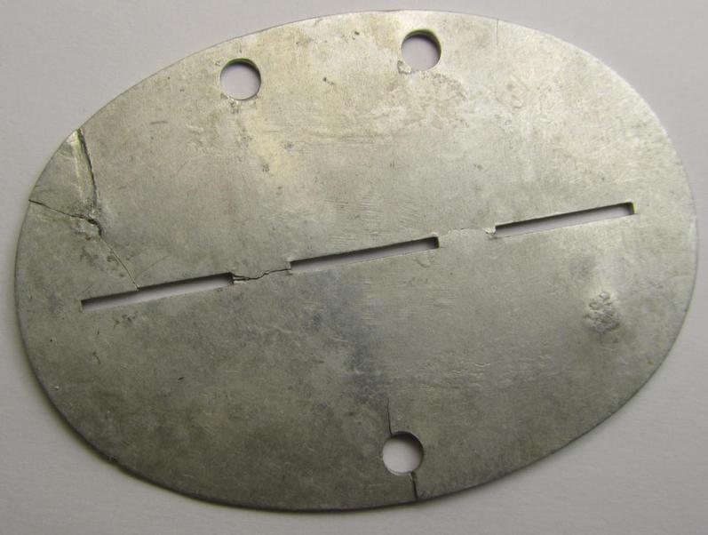 Aluminium-based, WH (Heeres) ie. 'Artillerie'-related ID-disc (ie. 'Erkennungsmarke') bearing the stamped unit-designation that reads: '1./Art.Ers.Abt. 246'