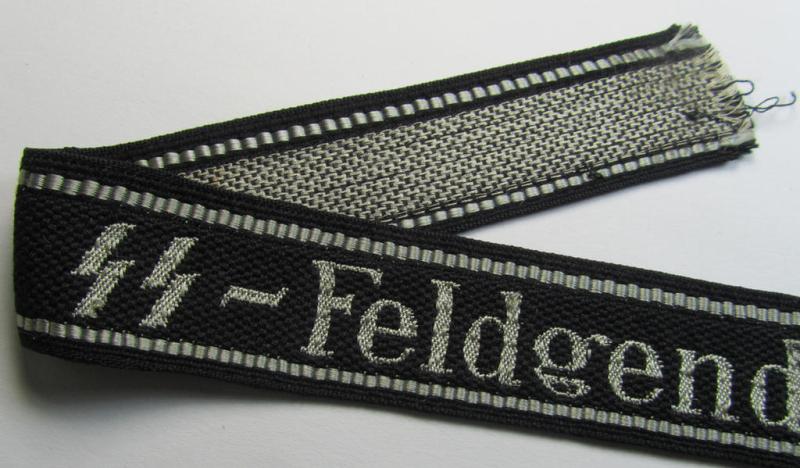 Superb - and truly rarely encountered! - example of a Waffen-SS, 'semi-BeVo'-pattern, EM- (ie. NCO-) type cuff-title (ie. 'Ärmelstreifen') as was intended for a member serving within the: 'SS-Feldgendarmerie'