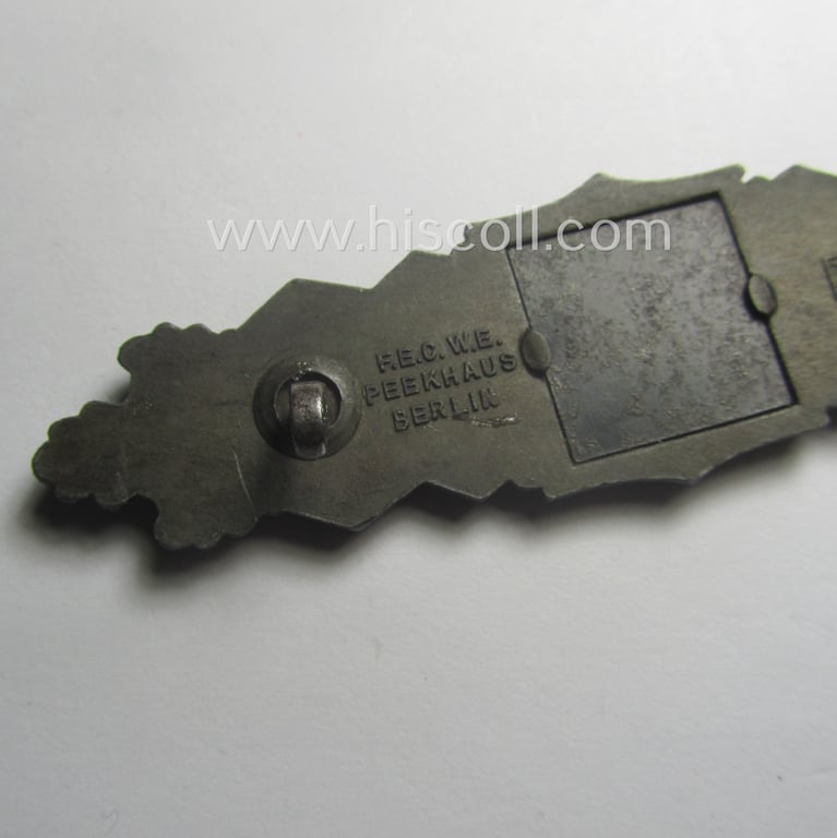 'Nahkampfspange in Bronze' (or: bronze-class close-combat clasp ie. CCC) being a neatly maker-marked- and/or minimally converse-shaped specimen as was produced by the: 'JFS'- (ie. 'Joseph Feix u. Söhne'-) company