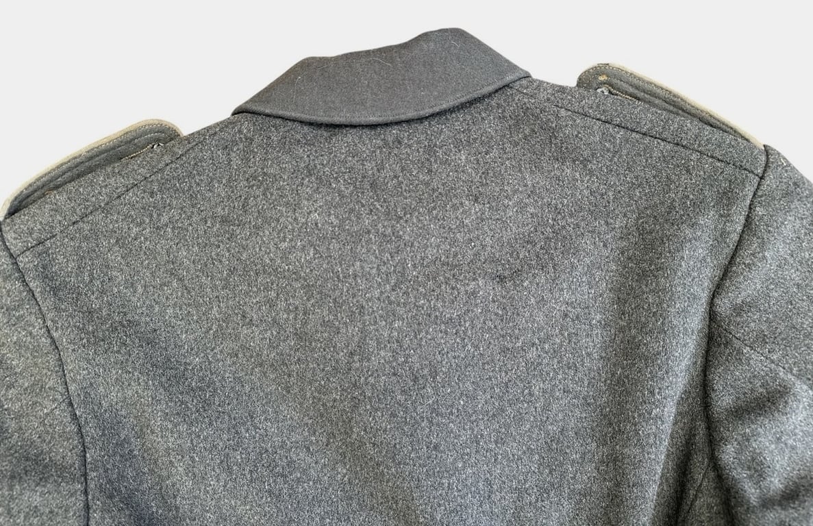 DRK (Deutsches Rotes Kreuz)  Vorhelfer service tunic with original insignia and armband.