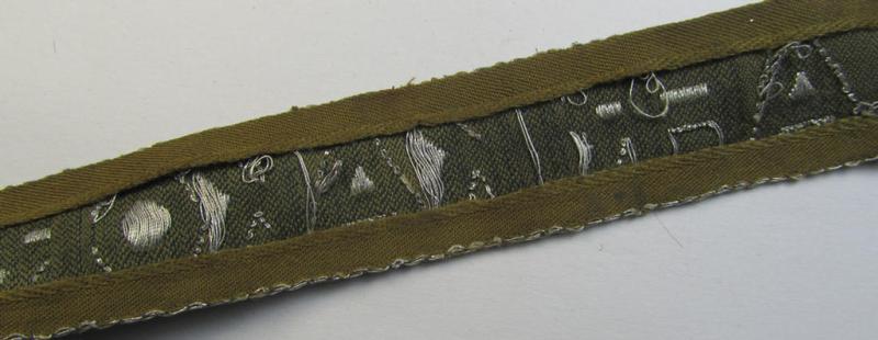 Superb, 'BeVo'-like cuff-title (ie. 'Ärmelstreifen') entitled: 'Afrikakorps' being a with certainty issued and truly worn example that comes in an overall nice- (ie. non-shortened- and most certainly once tunic-attached-), condition