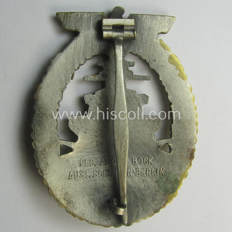 Moderately used, WH (Kriegsmarine) 'Flottenkriegsabzeichen' (or: high-sea fleet badge) being a typical 'Buntmetall'-based specimen that is neatly maker- (ie. 'Fec. Adolf Bock') marked on its back