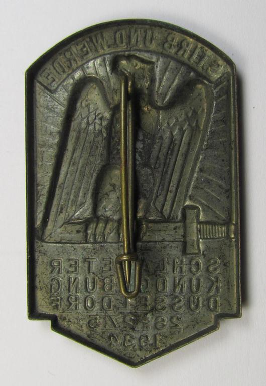 Commemorative, tin-based- and/or: golden-bronze-coloured (I deem) N.S.D.A.P.-related 'tinnie' depicting an eagle-device resting on a sword and that is entitled: 'Stirb und Werde - Schlageterkundgebung - Düsseldorf - 26.27.5.1934'