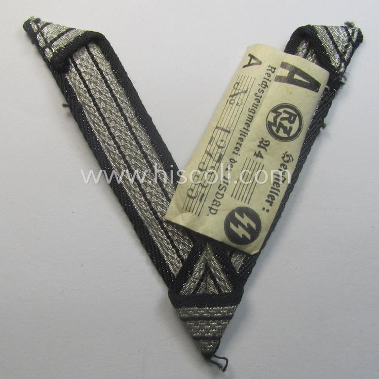 SS (ie. 'Allgemeine o. Waffen-SS') arm-insignia being an 'SS', so-called: 'Ehrenwinkel für Altgediente Kämpfer o. Angehörigen der SS' (or: honorary-chevron for old campaigners) still retaining its period 'RzM'-etiket